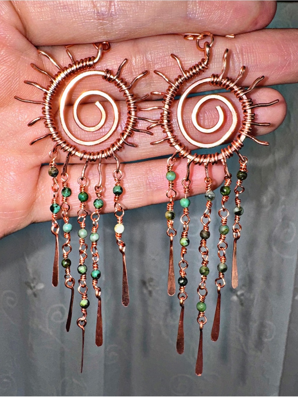 Handcrafted Copper Spiral Sun Earrings with Green Beads